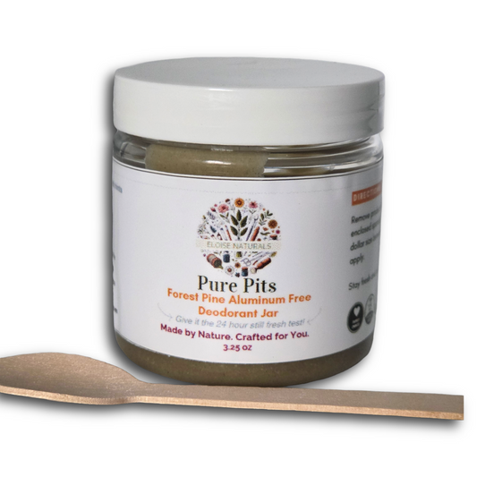 A jar of Eloise Naturals Pure Pits Forest Pine Aluminum Free Deodorant with a white lid and a small wooden spoon in front, on a white background.